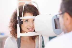 A woman and an Optometrist in exam room