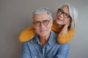 Portrait,Of,Relaxed,Fun,Senior,Couple,Wearing,Glasses,On,Background